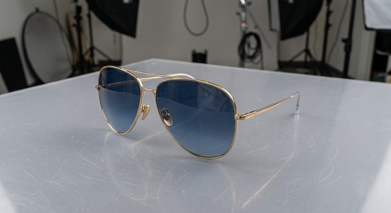 Sunglasses before editing, original shot with background and lens reflections